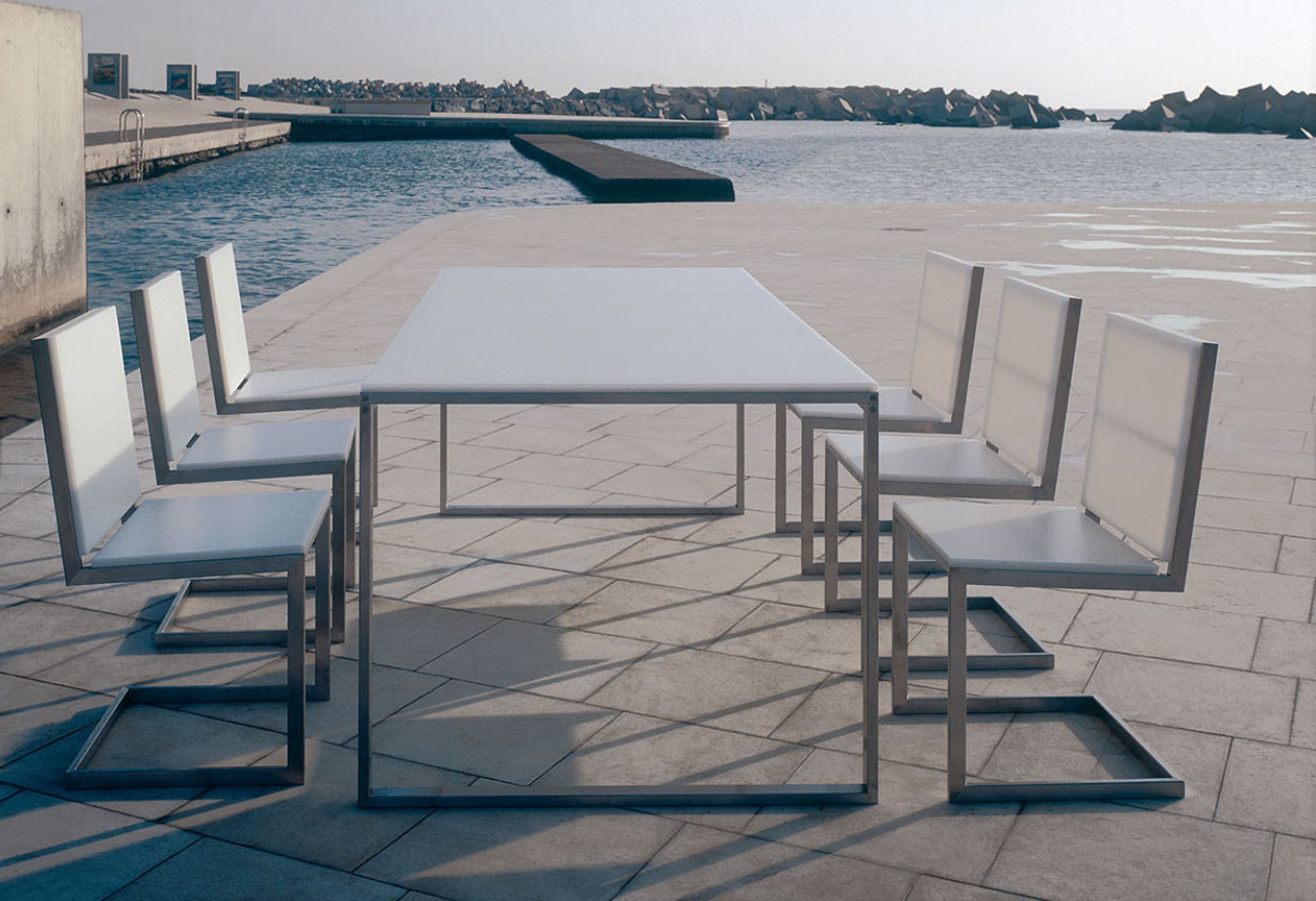 Admirable Modern Outdoor Inspiration With White Dining Table With Silver Base And White Chairs Fascinating Modern Outdoor Inspiration (View 17 of 28)