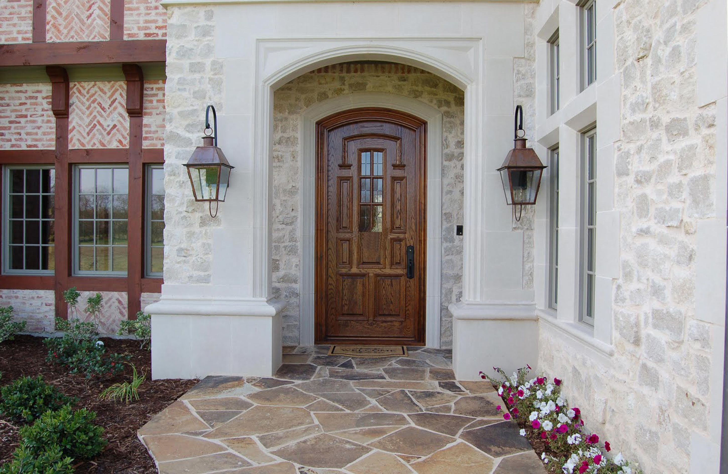 Luxury Brown Wooden Front Entry Door With Glass Accents And Black Handle And Cream Stone Wall With Brown Wall Lamps And Also Brown Stone Floor Tile Formidable Front Entry Door Designs (View 38 of 123)