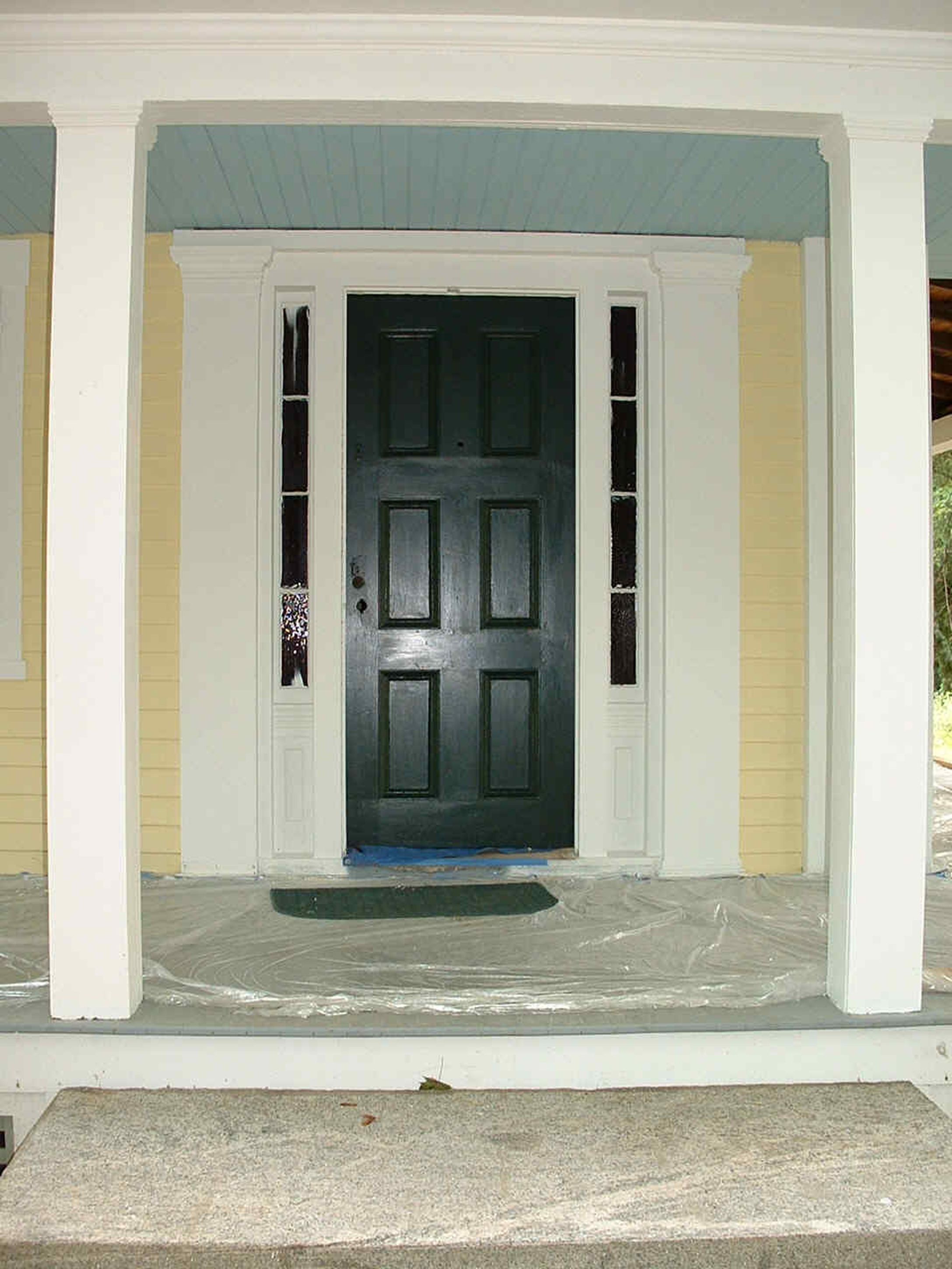 Romantic Black Front Entry Door With Yellow Wall Color With White Accents And Gray Floor Tile With Green Doormat Together With White Pillars Formidable Front Entry Door Designs (View 11 of 39)