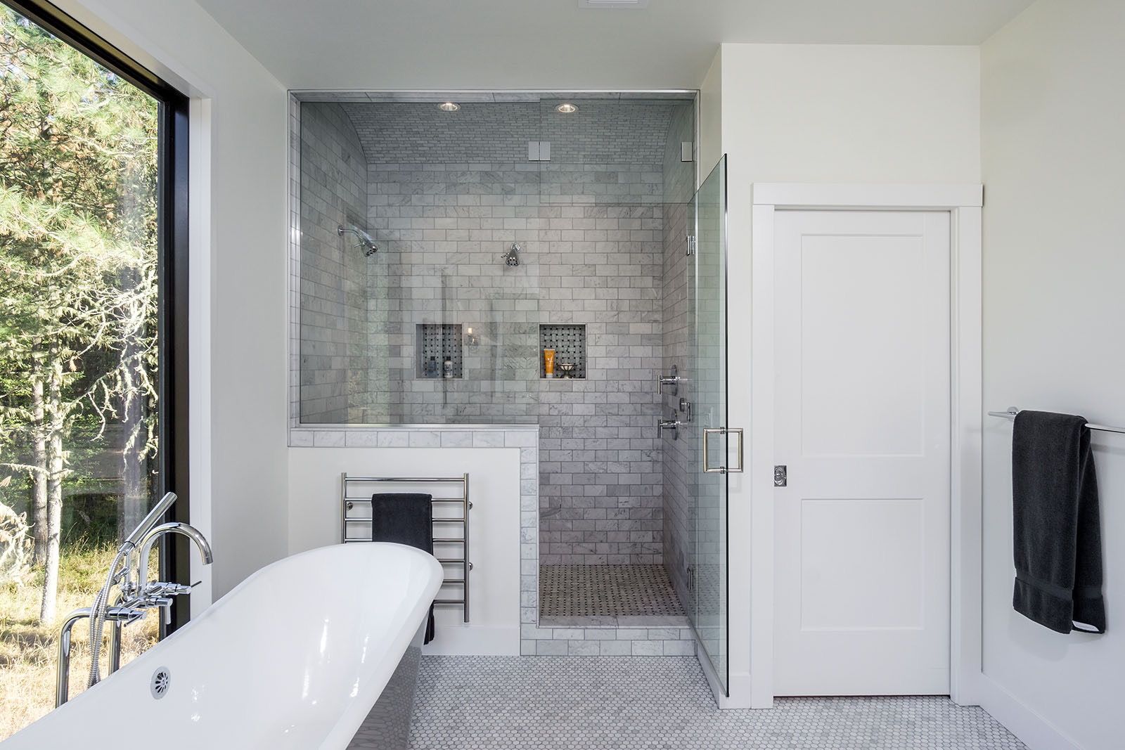 Contemporary Bathroom With Walk In Black White Subway Tile Shower, Penny Tile Floor And Window Placed Bathtub (View 1 of 17)