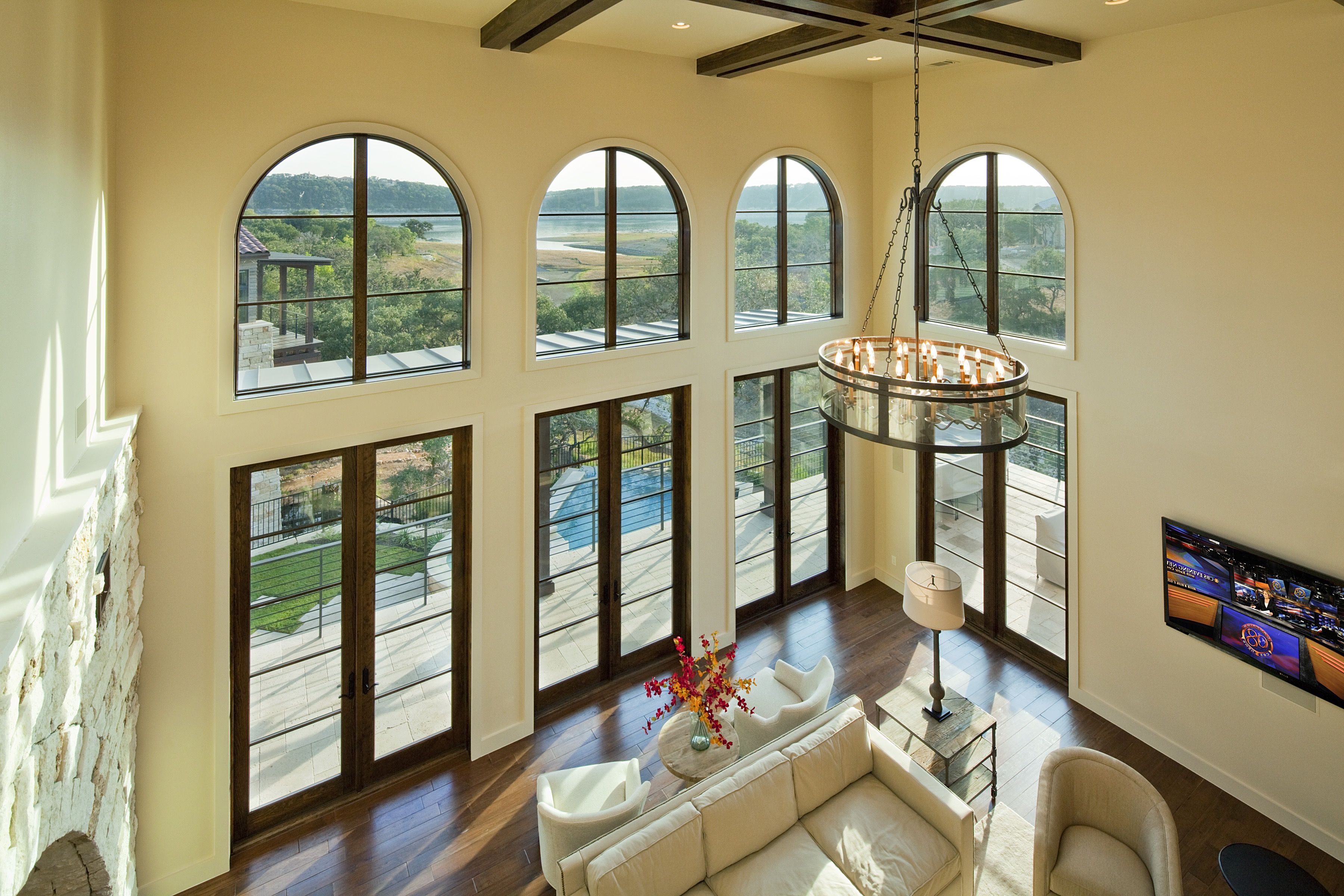 Mediterranean Living Room Boasts Grand Two Story Ceilings (View 10 of 25)