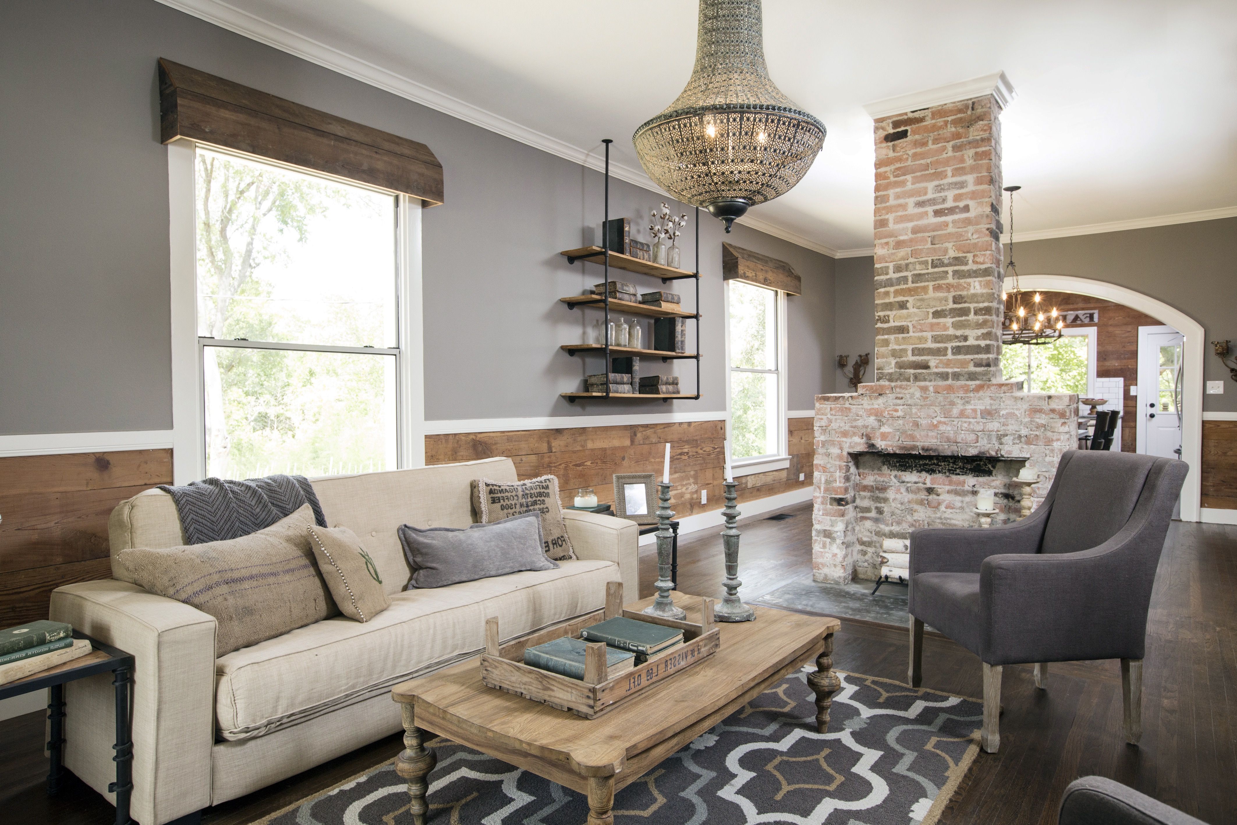 Rustic Chic Living Room With Natural Wood Paneling And Exposed Brick Fireplace (View 31 of 36)