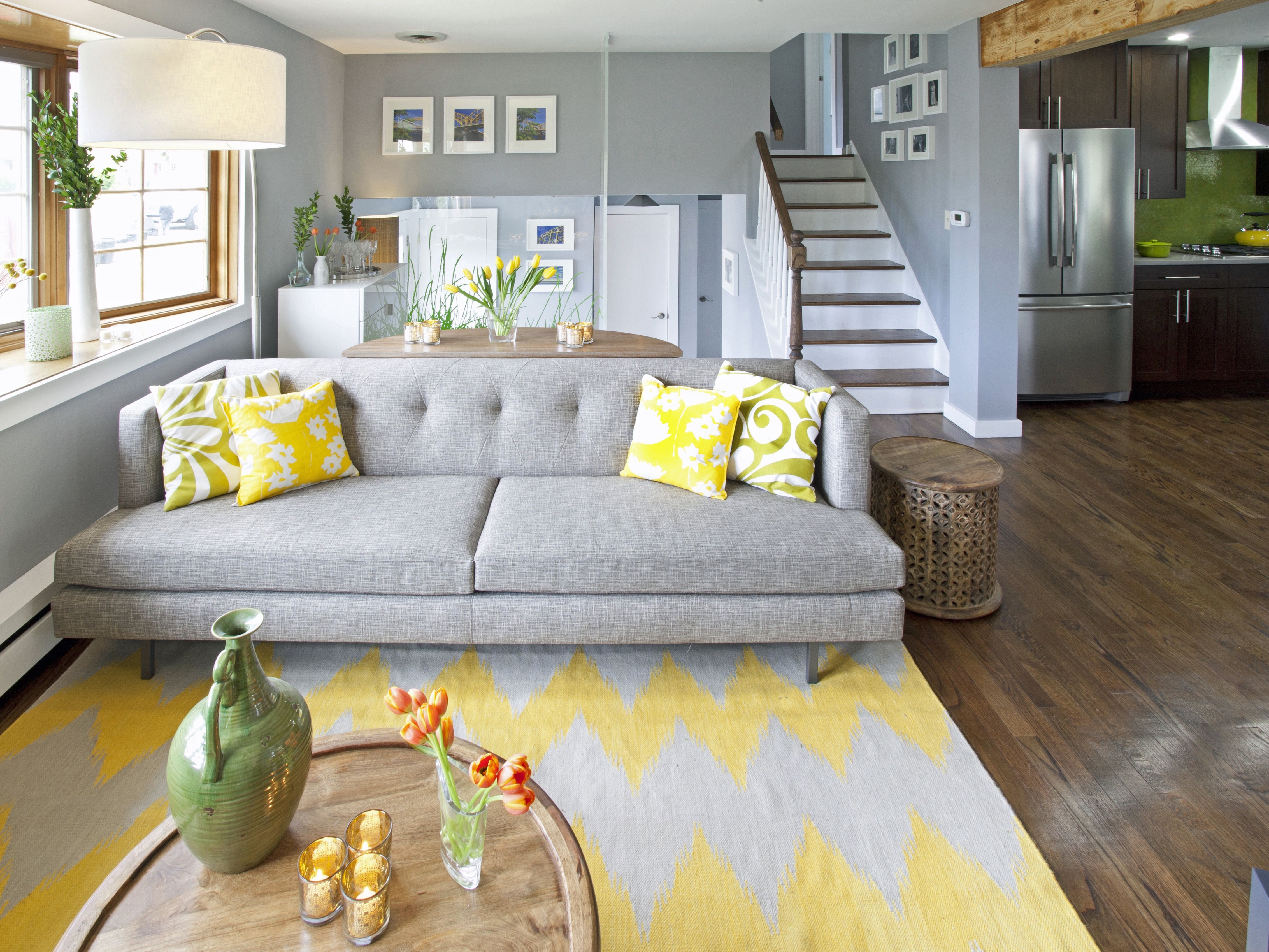 Chic Gray Tufted Sofa And Bright Yellow Throw Pillows (View 3 of 28)