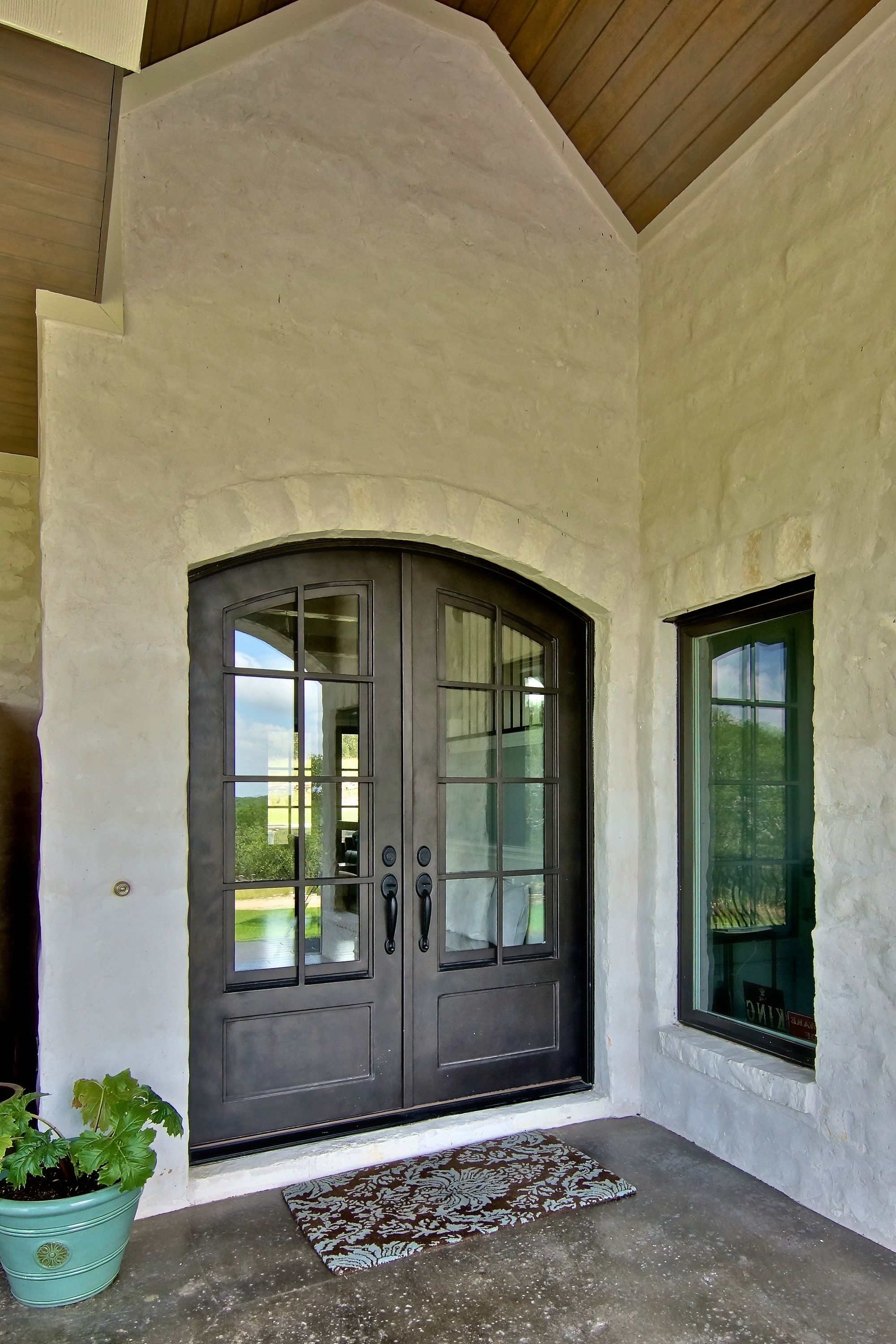 French Country Entry With Arched Doors (View 16 of 32)
