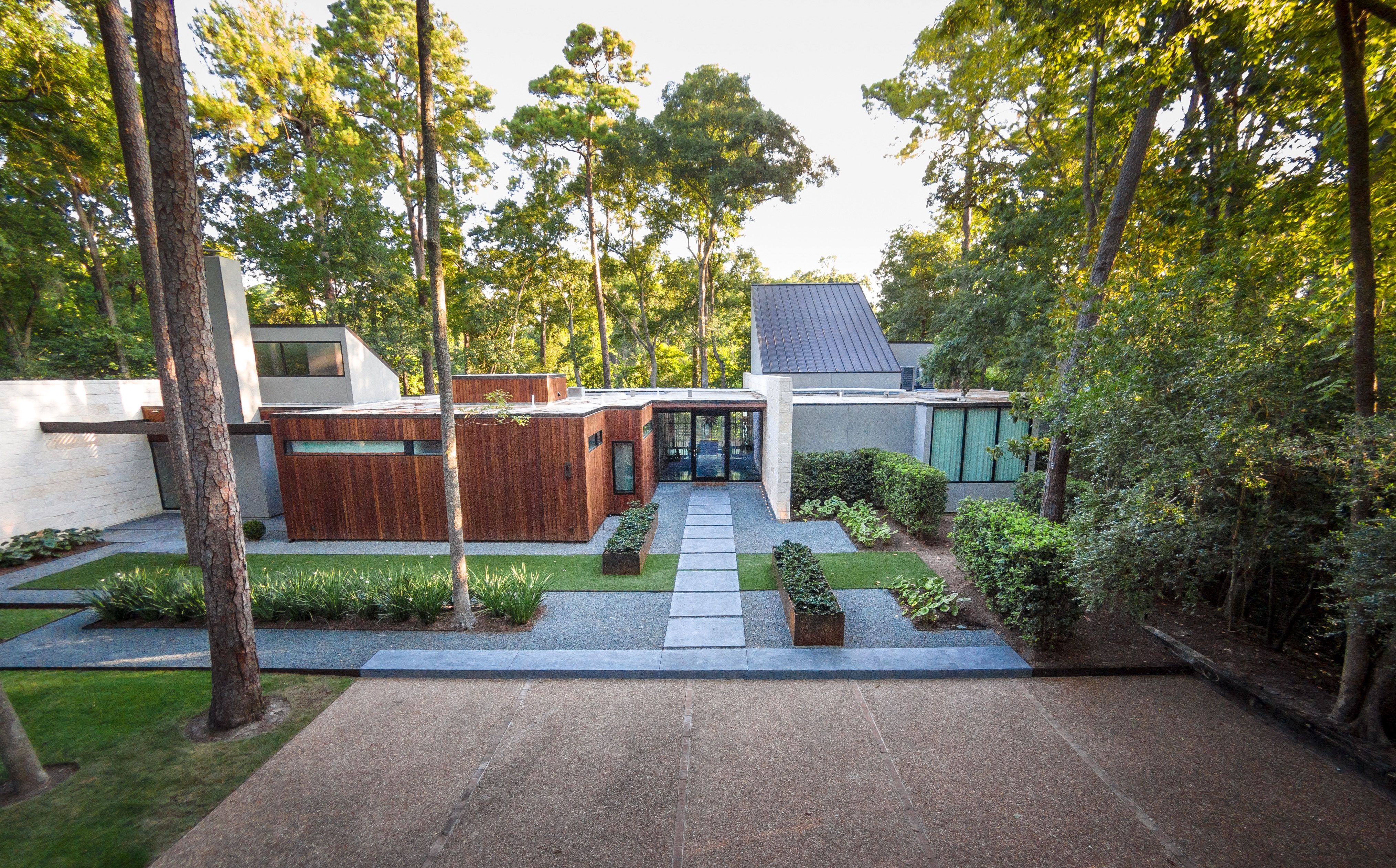Midcentury Modern Home Exterior With Concrete And Exotic Wood Exterior (View 9 of 27)