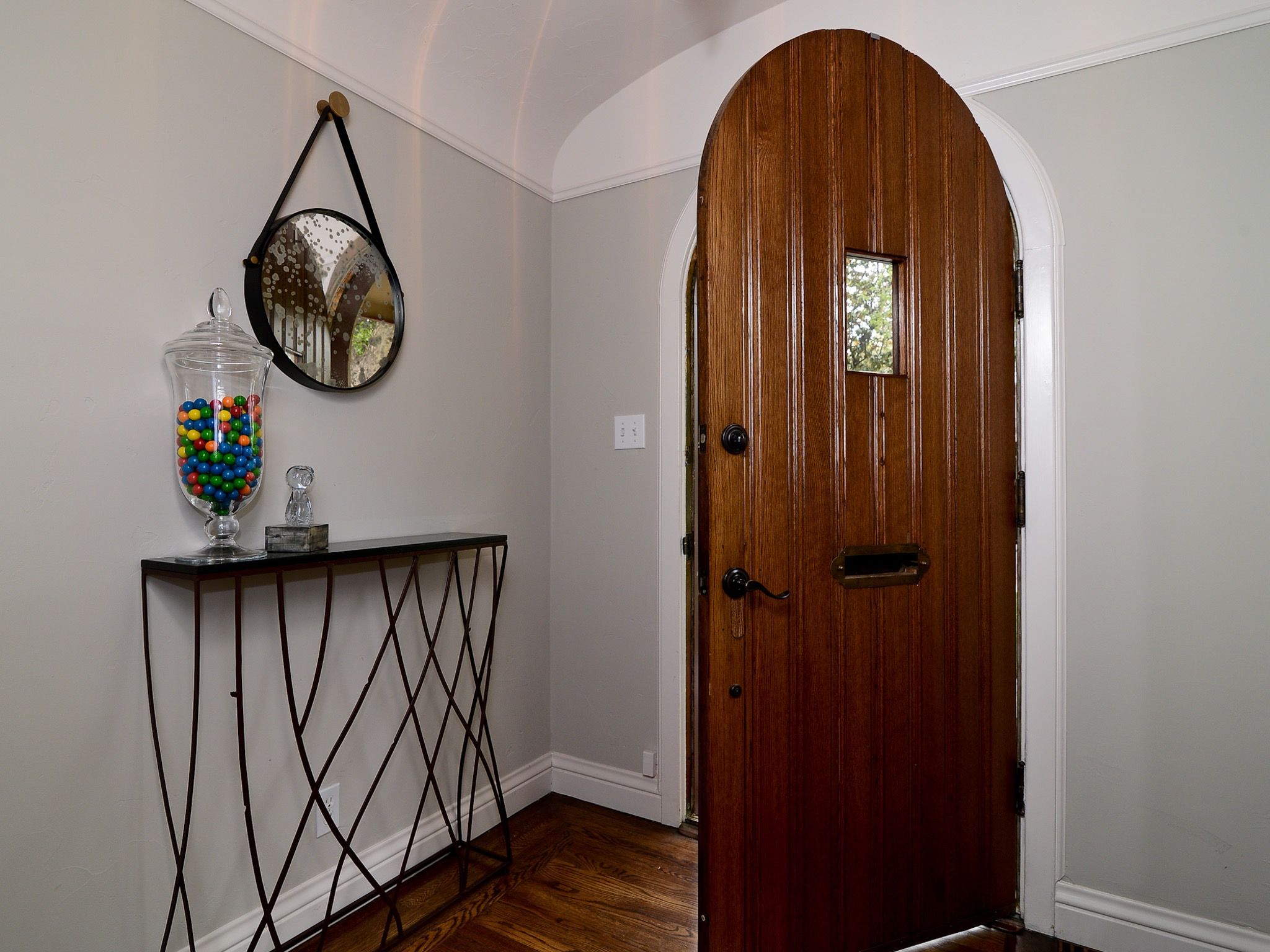 Neutral Entryway With Arched Front Door (View 25 of 32)
