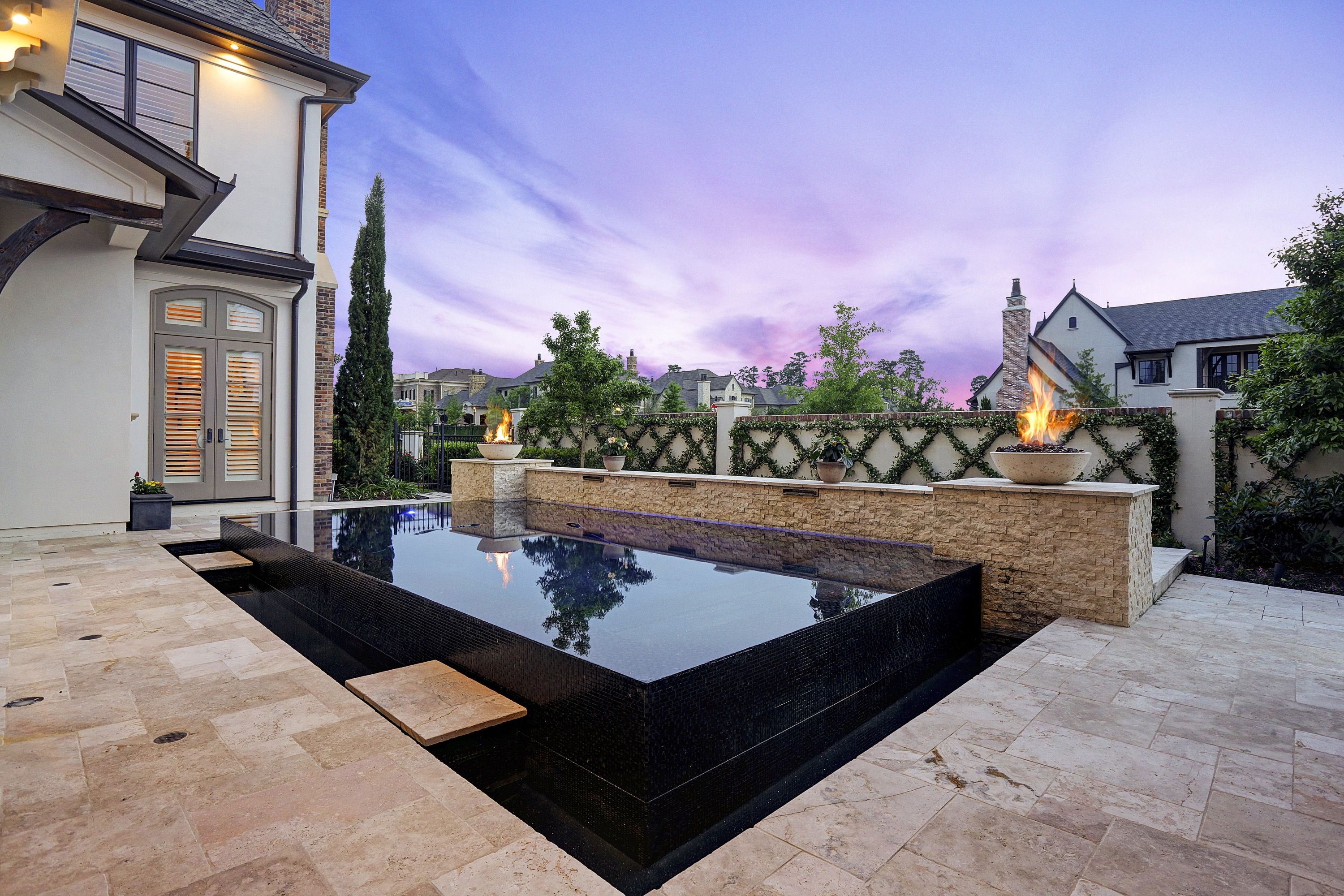 Neutral Stone Patio With Contemporary Infinity Pool (View 18 of 20)