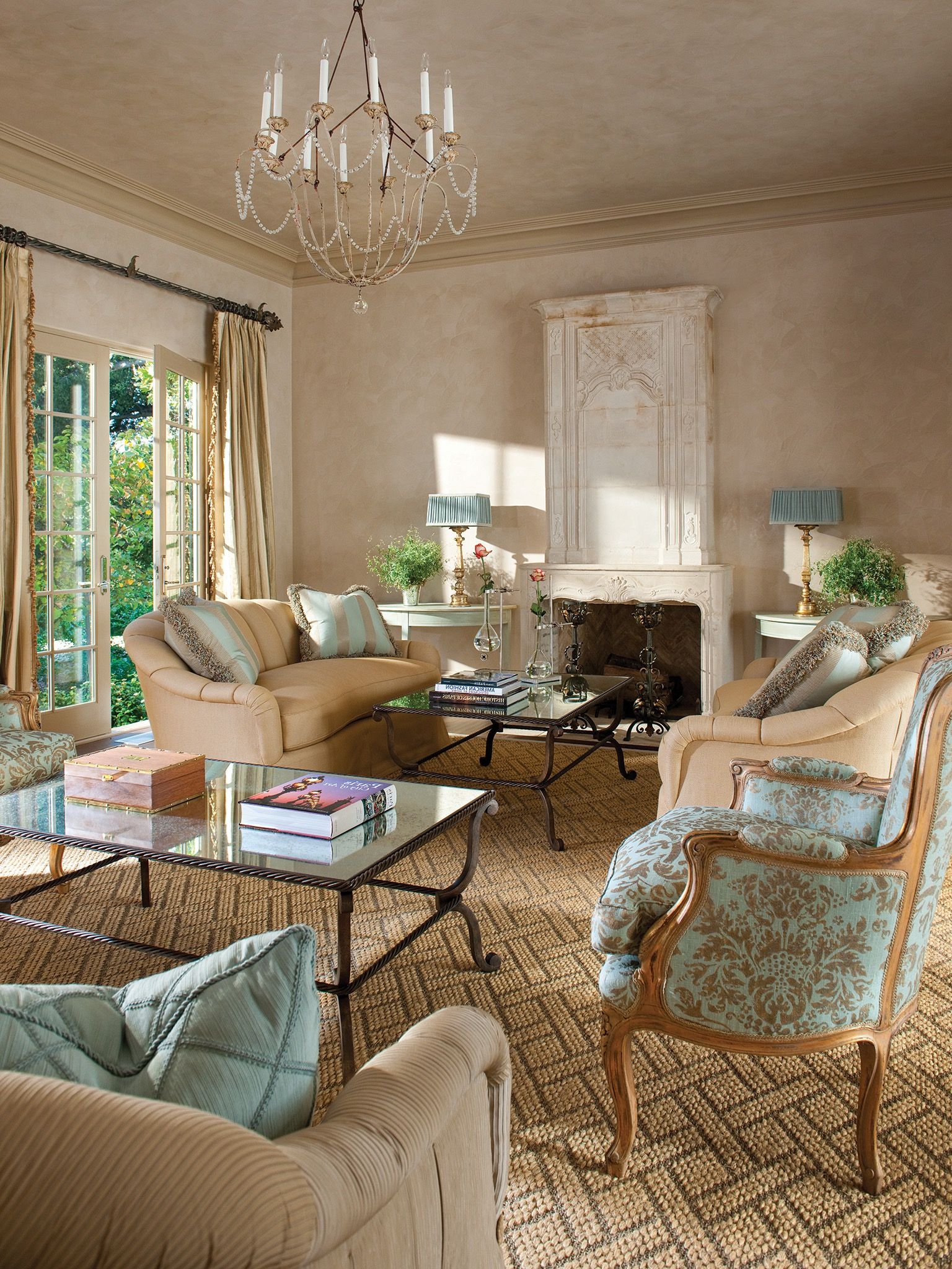 Italian Living Room Features An Elegant Fireplace And Striking Chandelier (View 9 of 20)