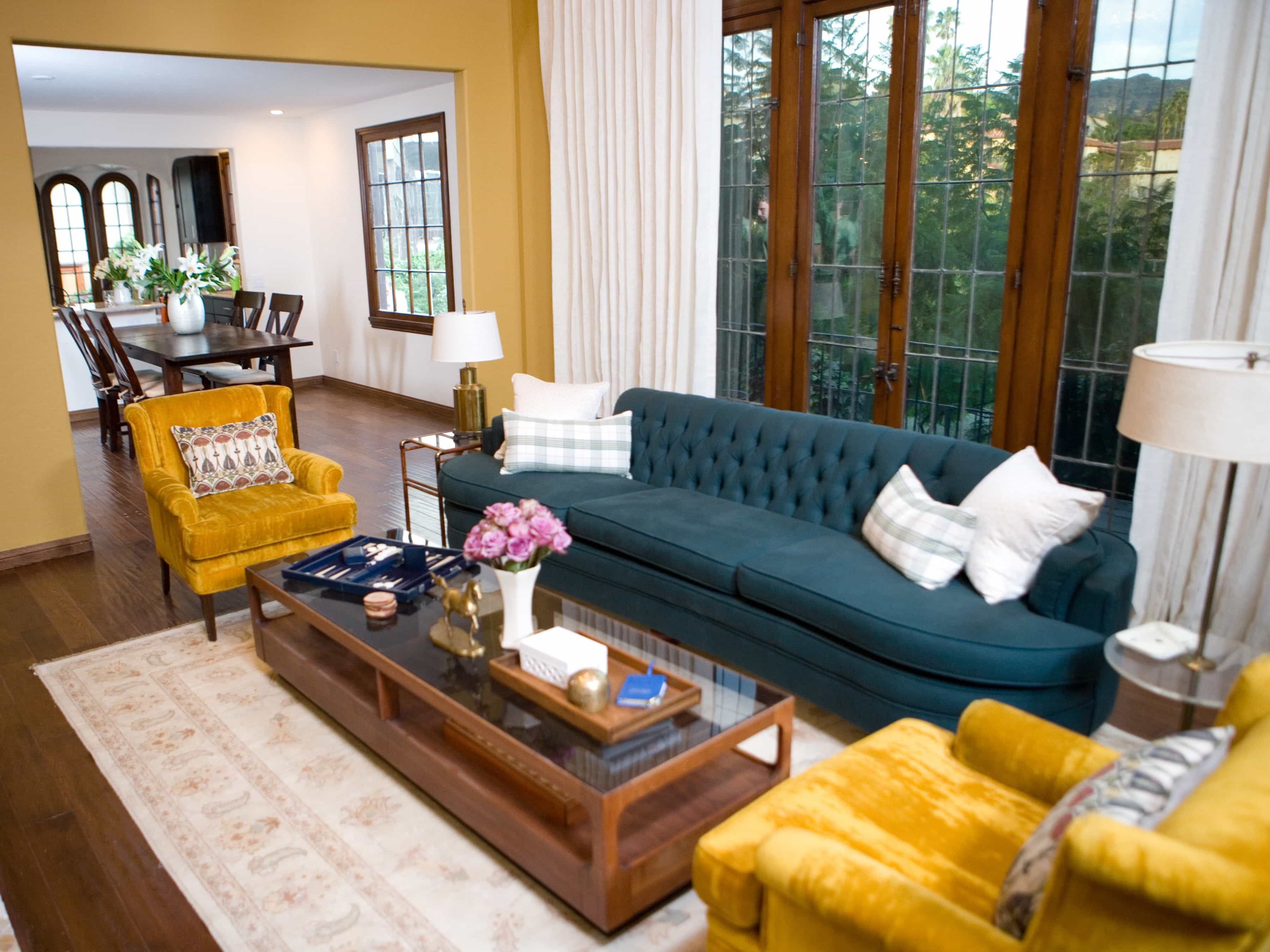 Chic Living Room Interior Decoration With Blue Tufted Sofa And Gold Velvet Chairs (View 1 of 16)