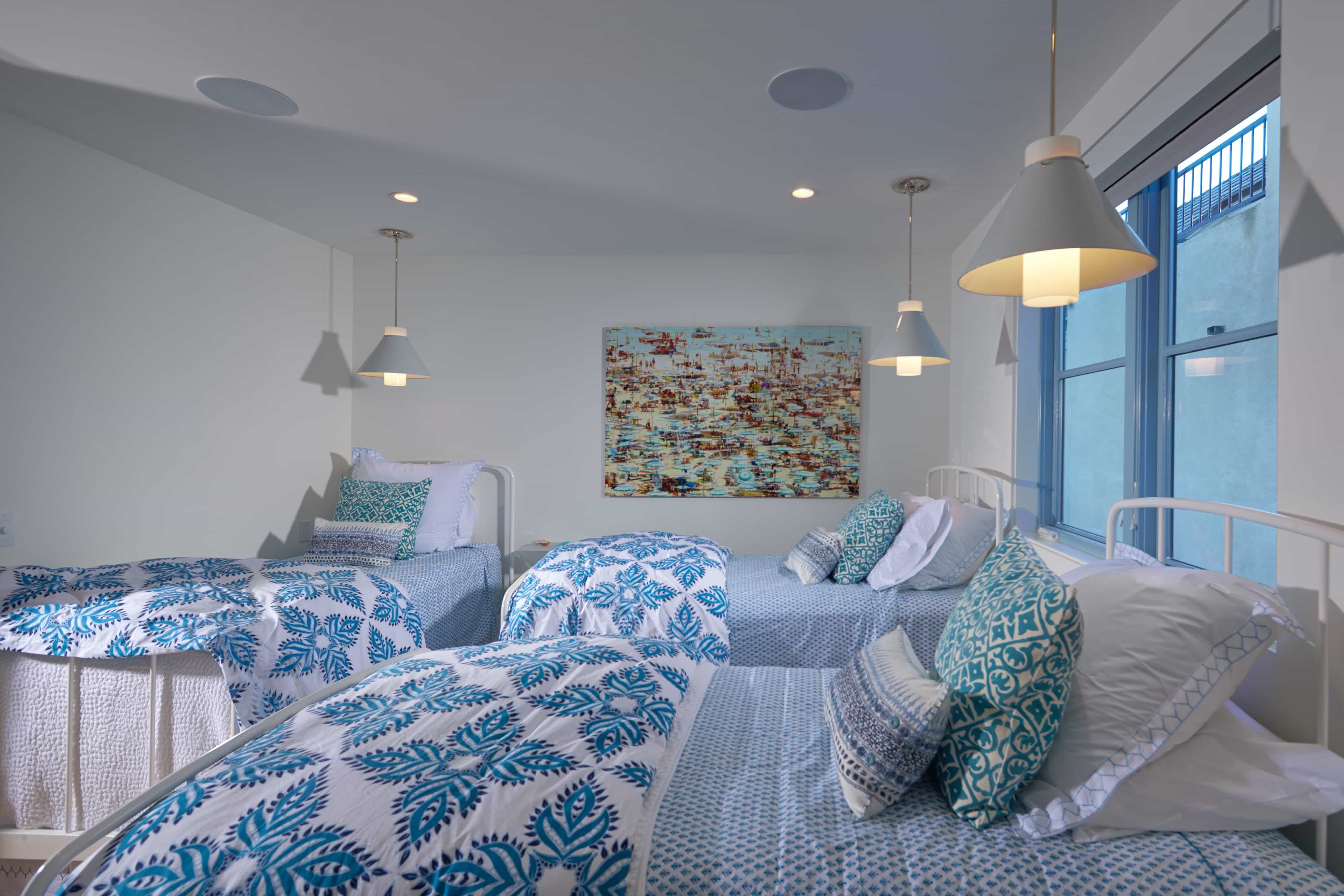 Child Bedroom Features Twin Beds With Blue Patterned Bedding  (View 18 of 27)
