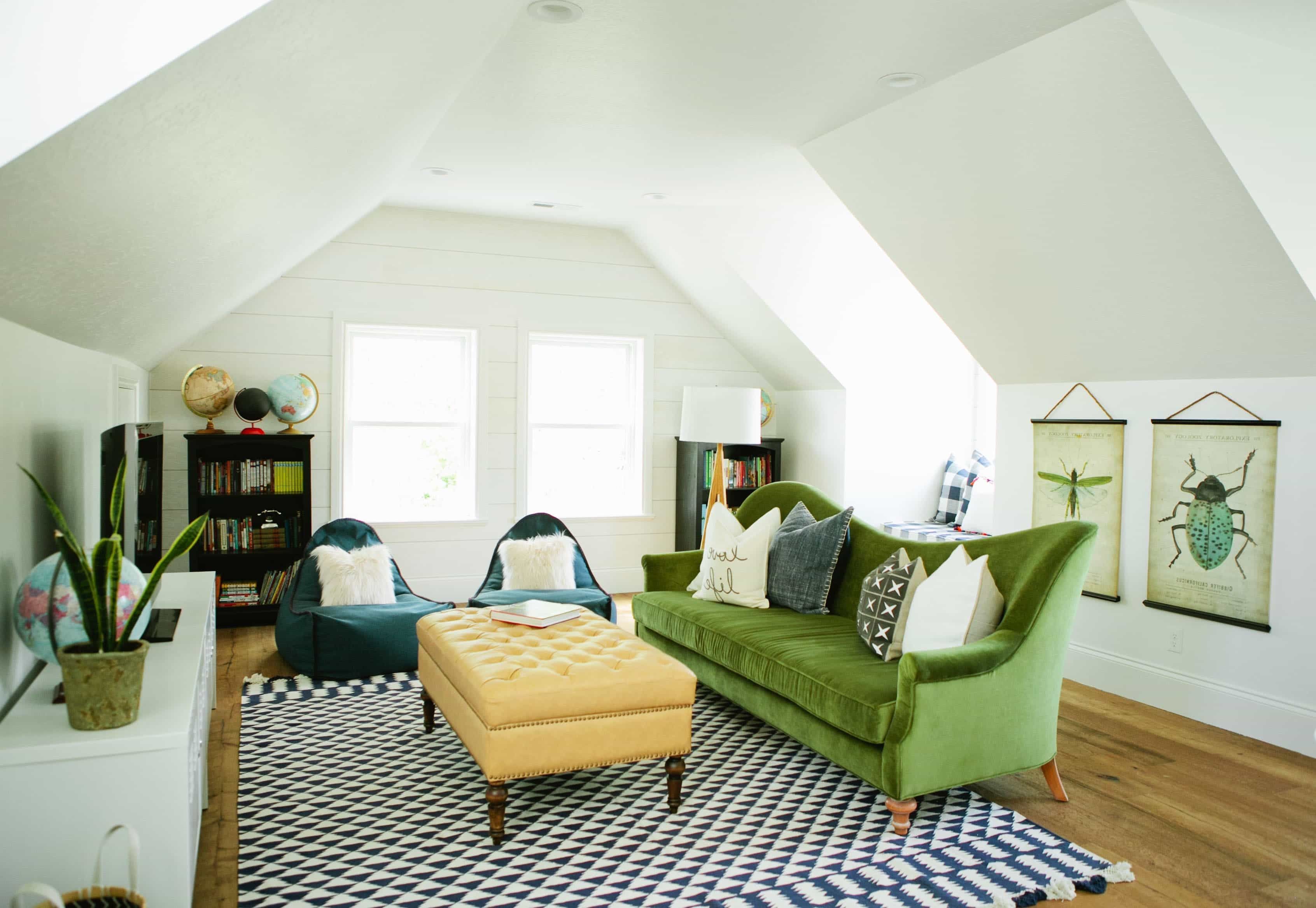 Cozy Attic Living Room Design With Warm Royal Sofa In Green Color And Black White Carpet Rug (Photo 9 of 31)