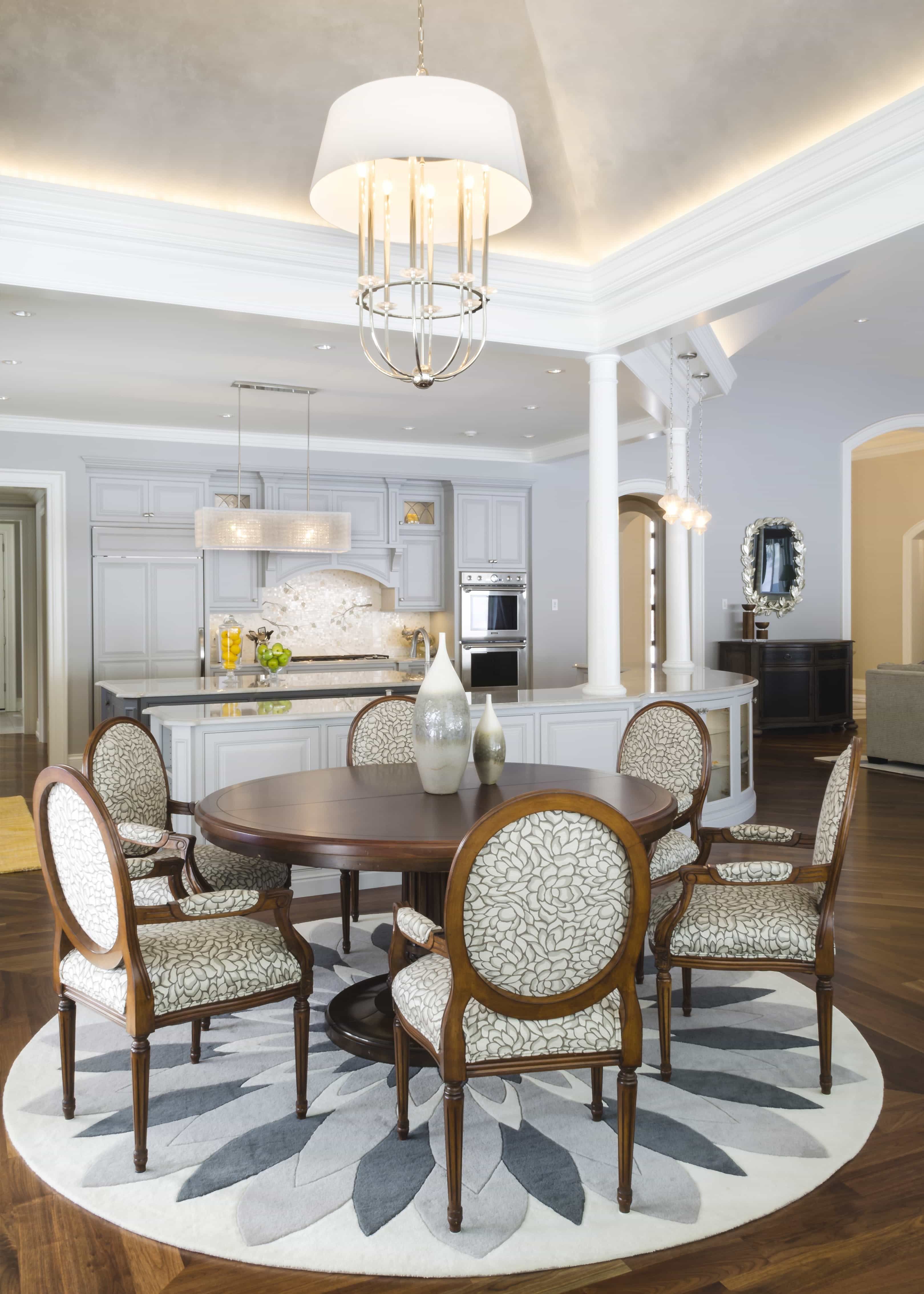 Stunning French Dining Room With Floral Accents And Eye Catching Chairs With Wooden Round Table (Photo 2 of 25)