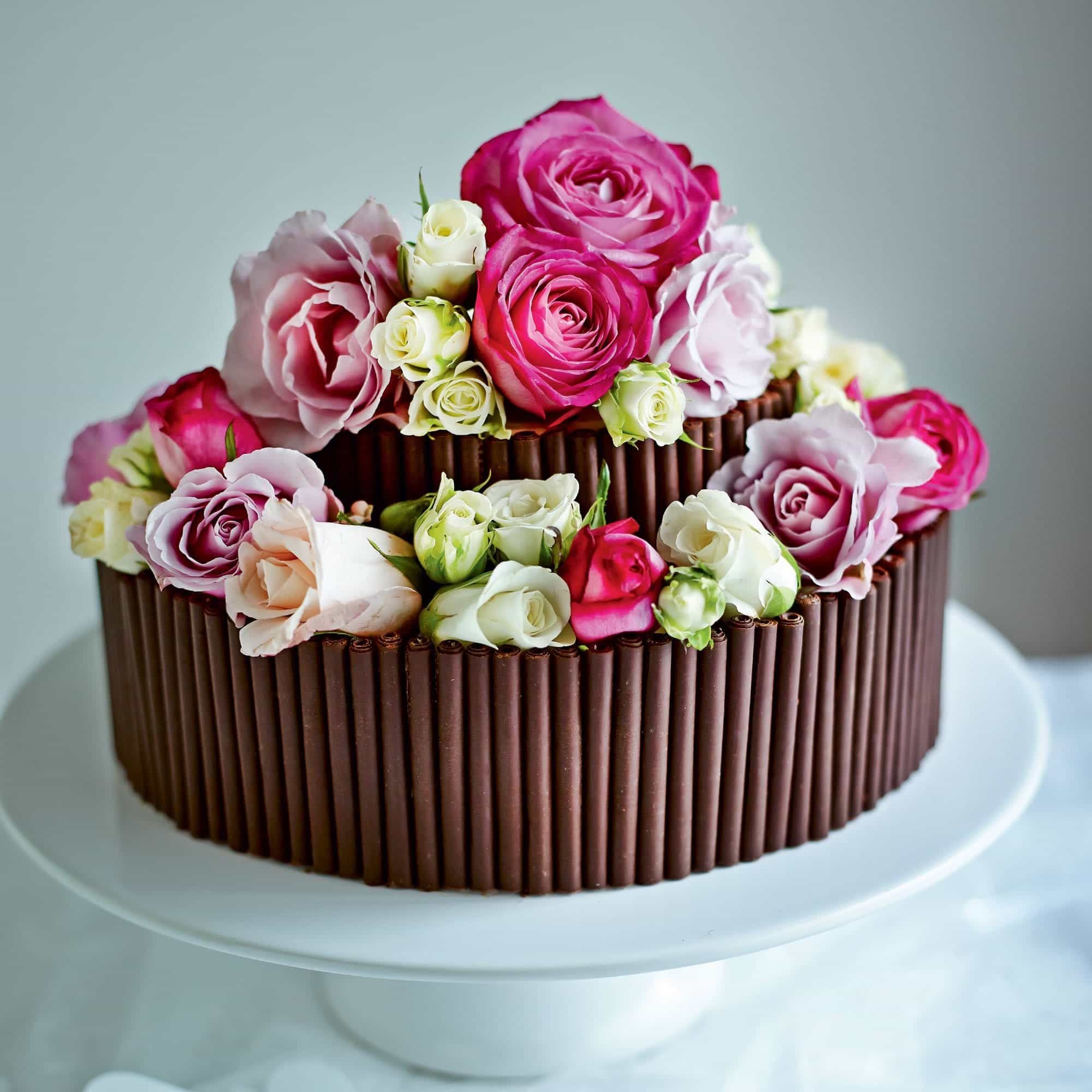 Small Chocolate Wedding Cake With Roses Top (Photo 10 of 30)