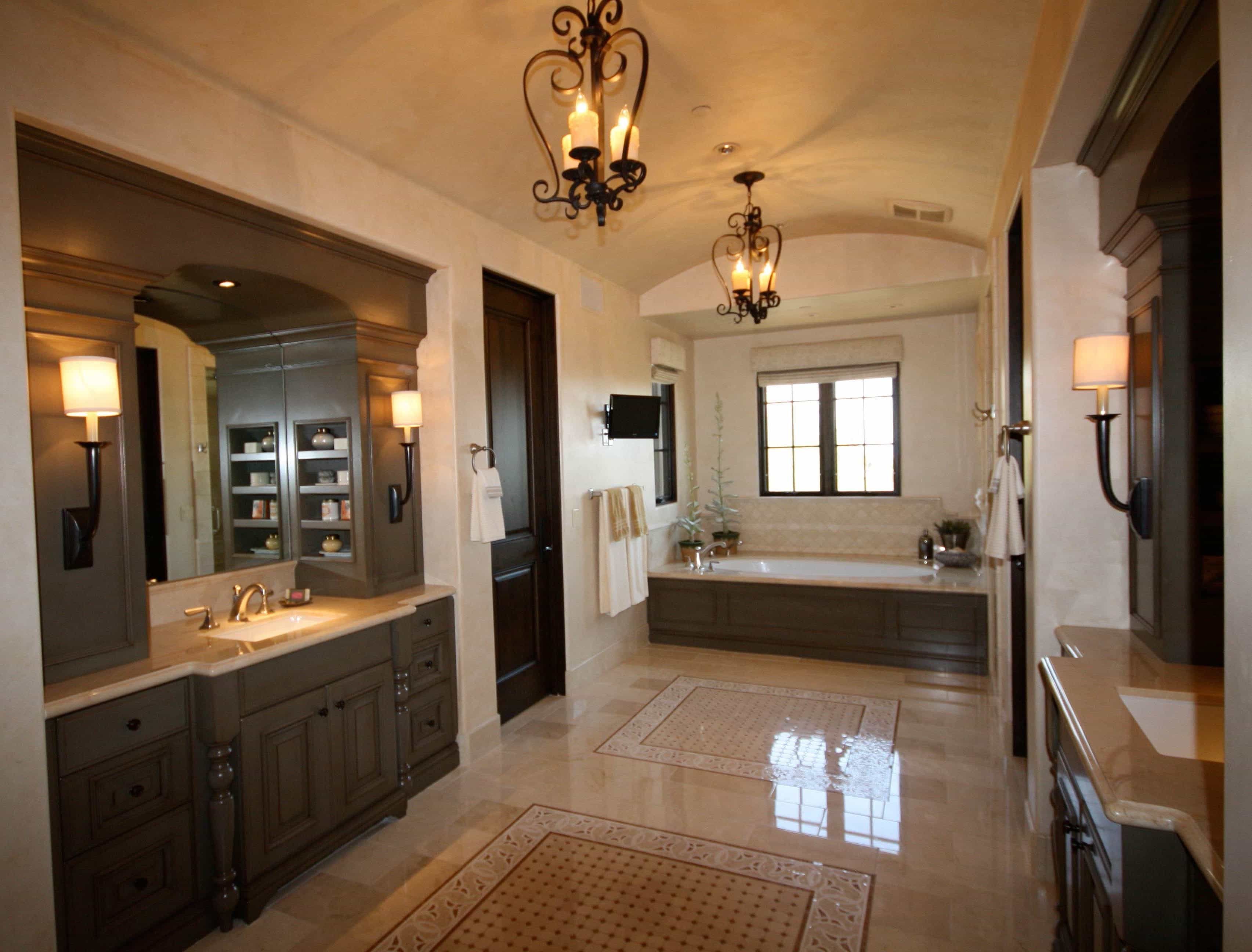 Terrazzo Flooring For Master Bathroom Is Decorated With Neutral Tones And Features An Alcove Bathtub, And Wrought Iron Candle Chandeliers (View 2 of 20)