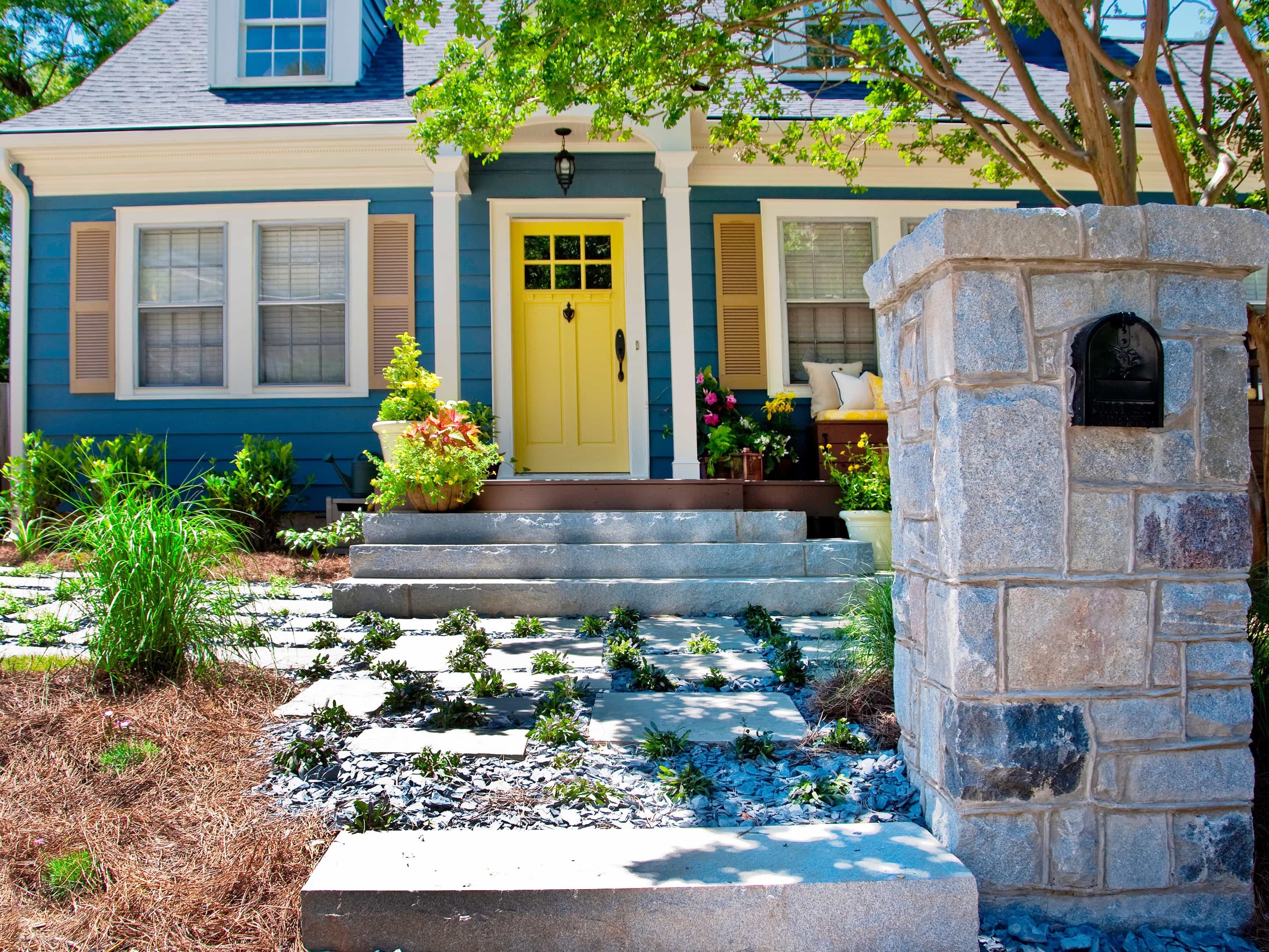 Featured Photo of Blue Cape Cod Style Home With Yellow Front Door