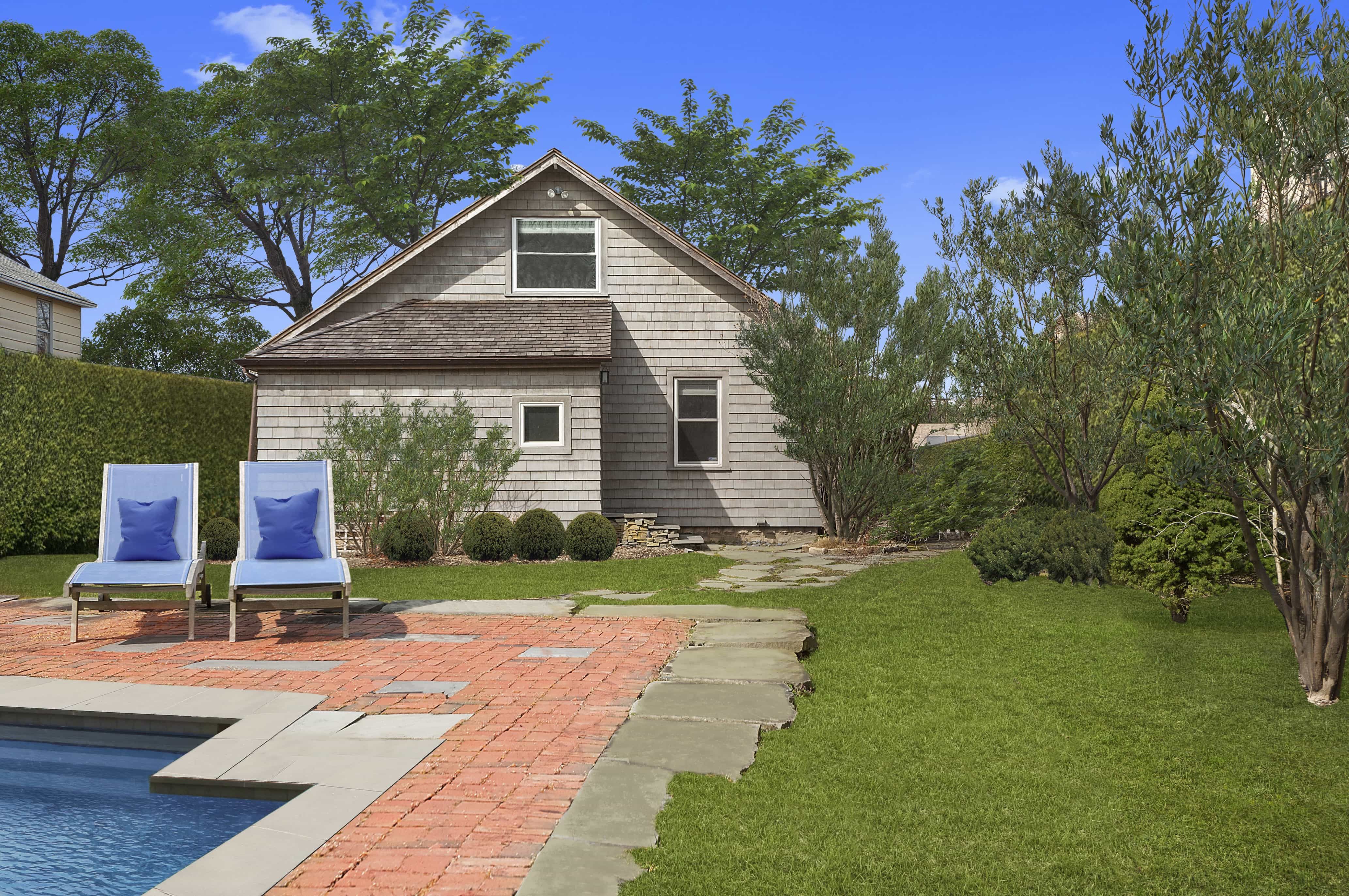 Featured Photo of Cottage Exterior With Brick Paver Pool Deck