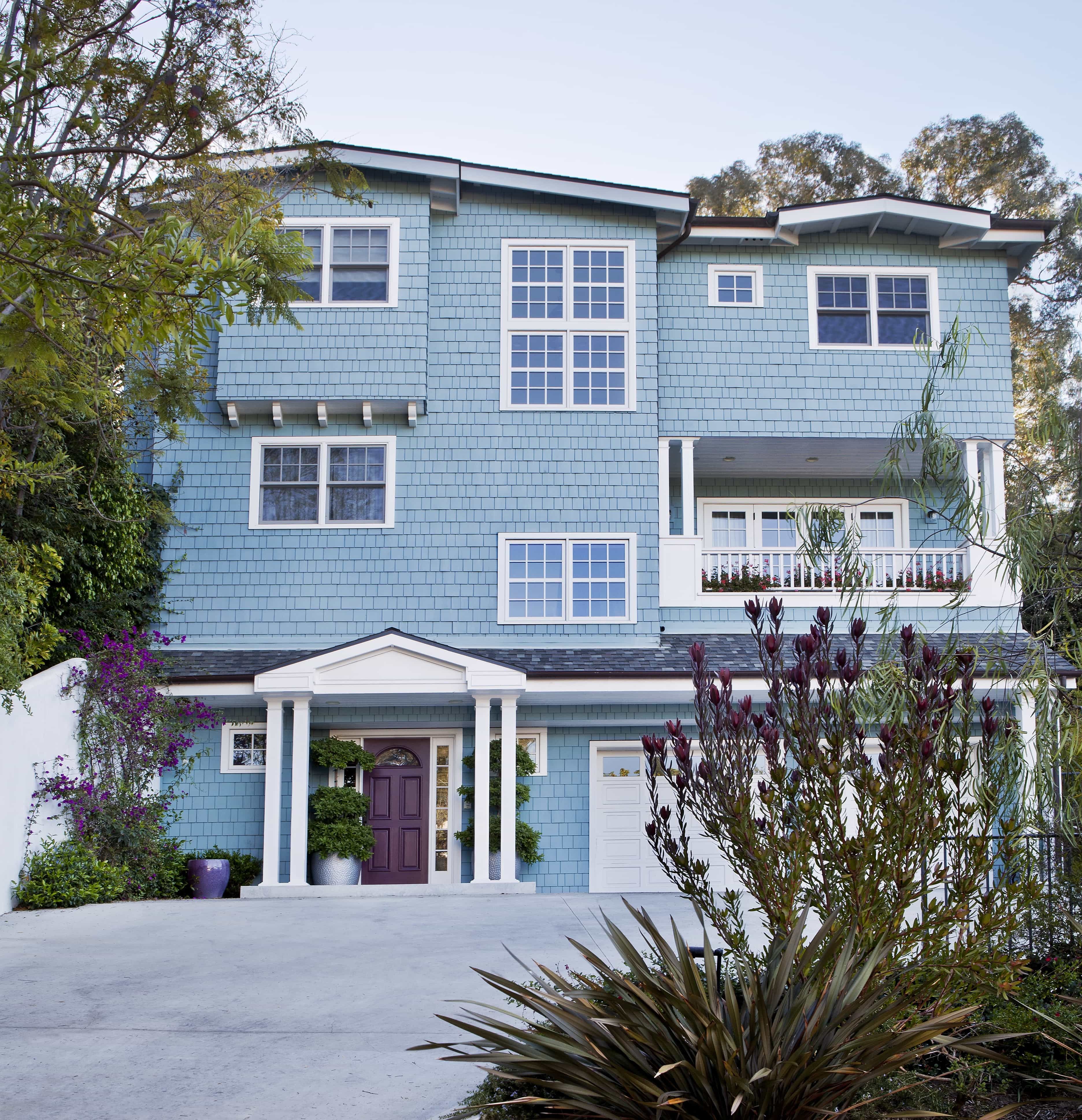 Featured Photo of Exterior of Brentwood Home With Baby Blue Wood Siding