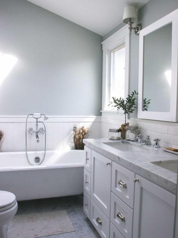 Gray Bathroom With White Wainscoting
