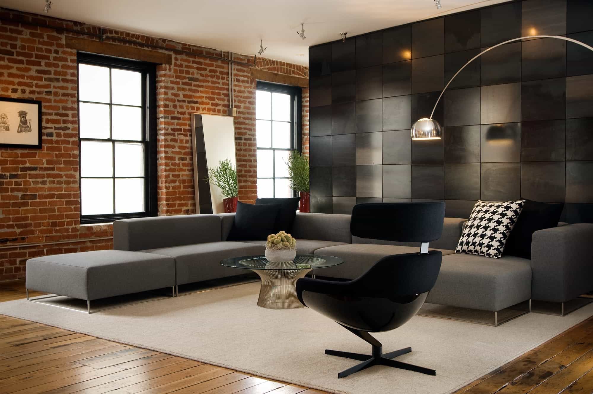 Loft Living Area Features Mod Gray Sectional And Exposed Brick Walls (View 11 of 30)