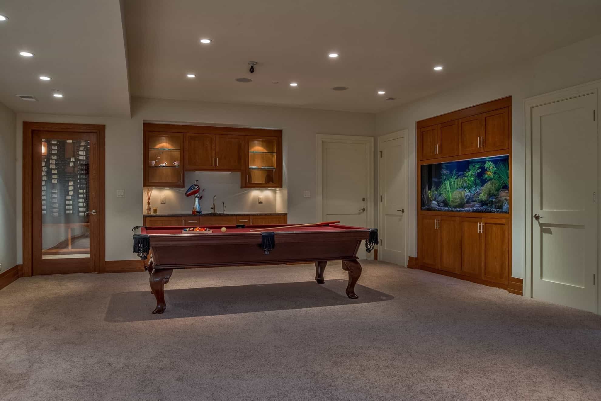Featured Photo of Modern Neutral Game Room With Built in Cabinet Fish Tank