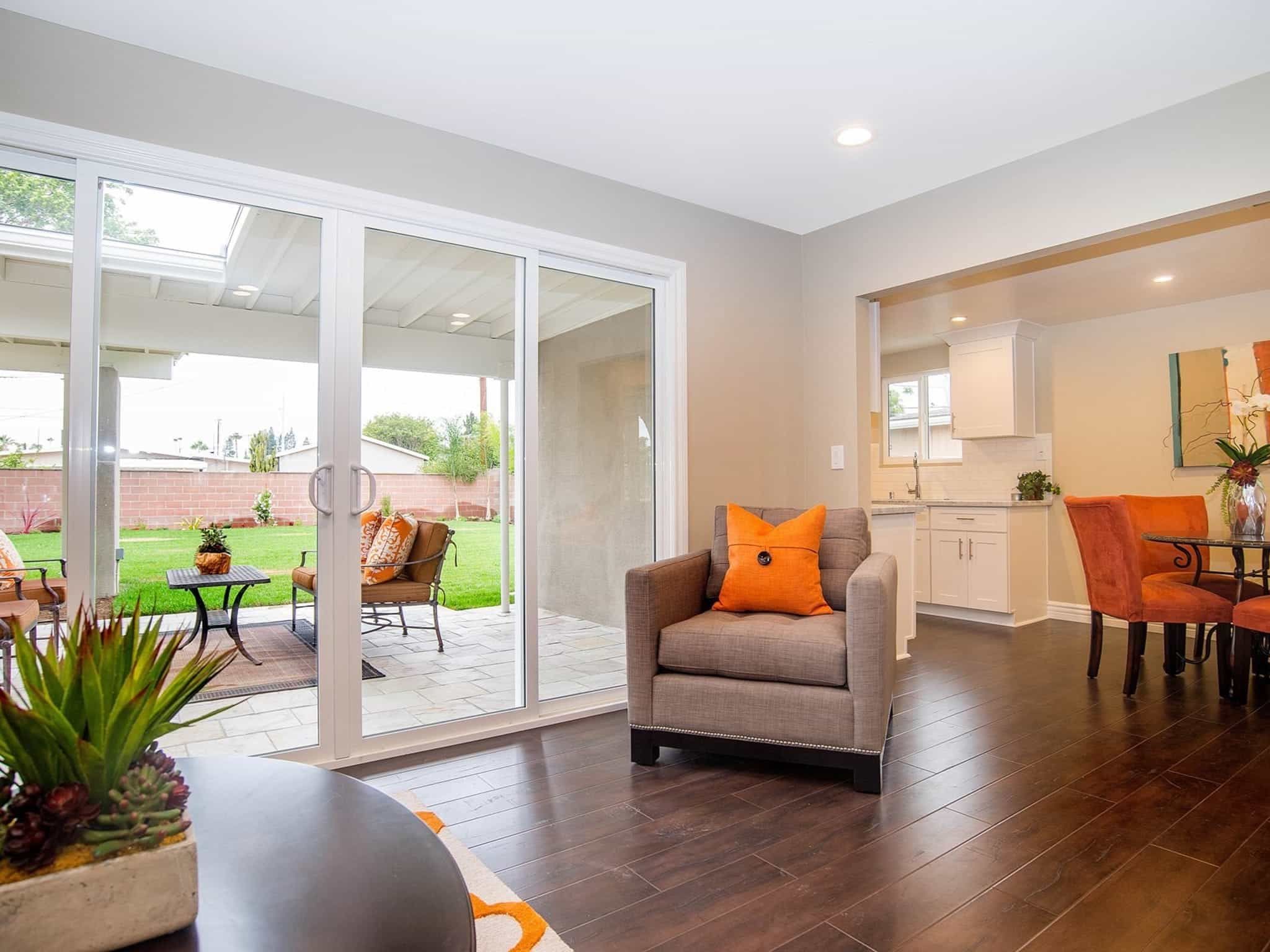 Cozy Living Room With Glass Sliding Door To Backyard And Patio