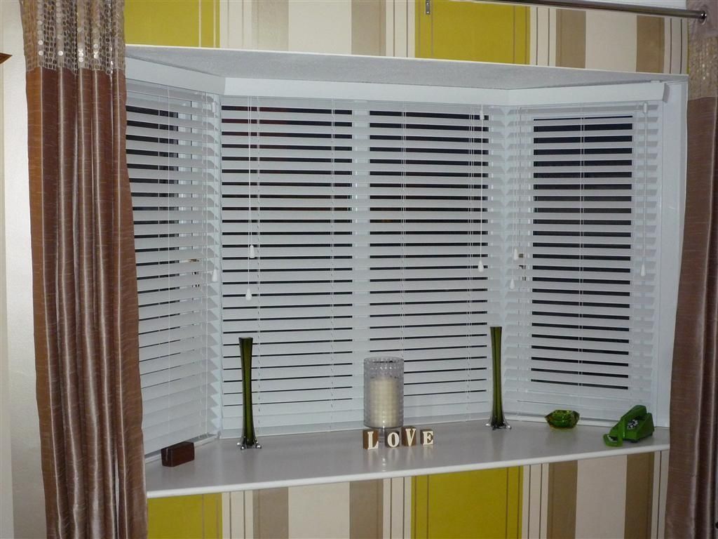 White Venetian Blinds Covering Bay Windows Revealed Behind Brown Regarding Fitted Curtains And Blinds (View 14 of 15)