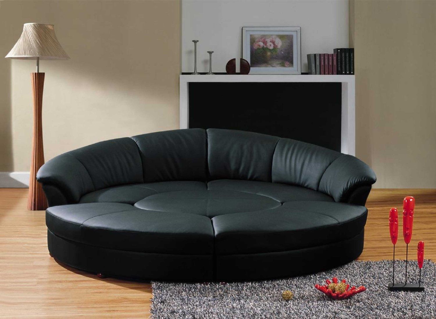 round pillows on leather sofa and wing chairs
