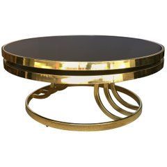 Design Institute Of America Brass And Glass Rotating Regarding Brass Smoked Glass Cocktail Tables (View 11 of 15)