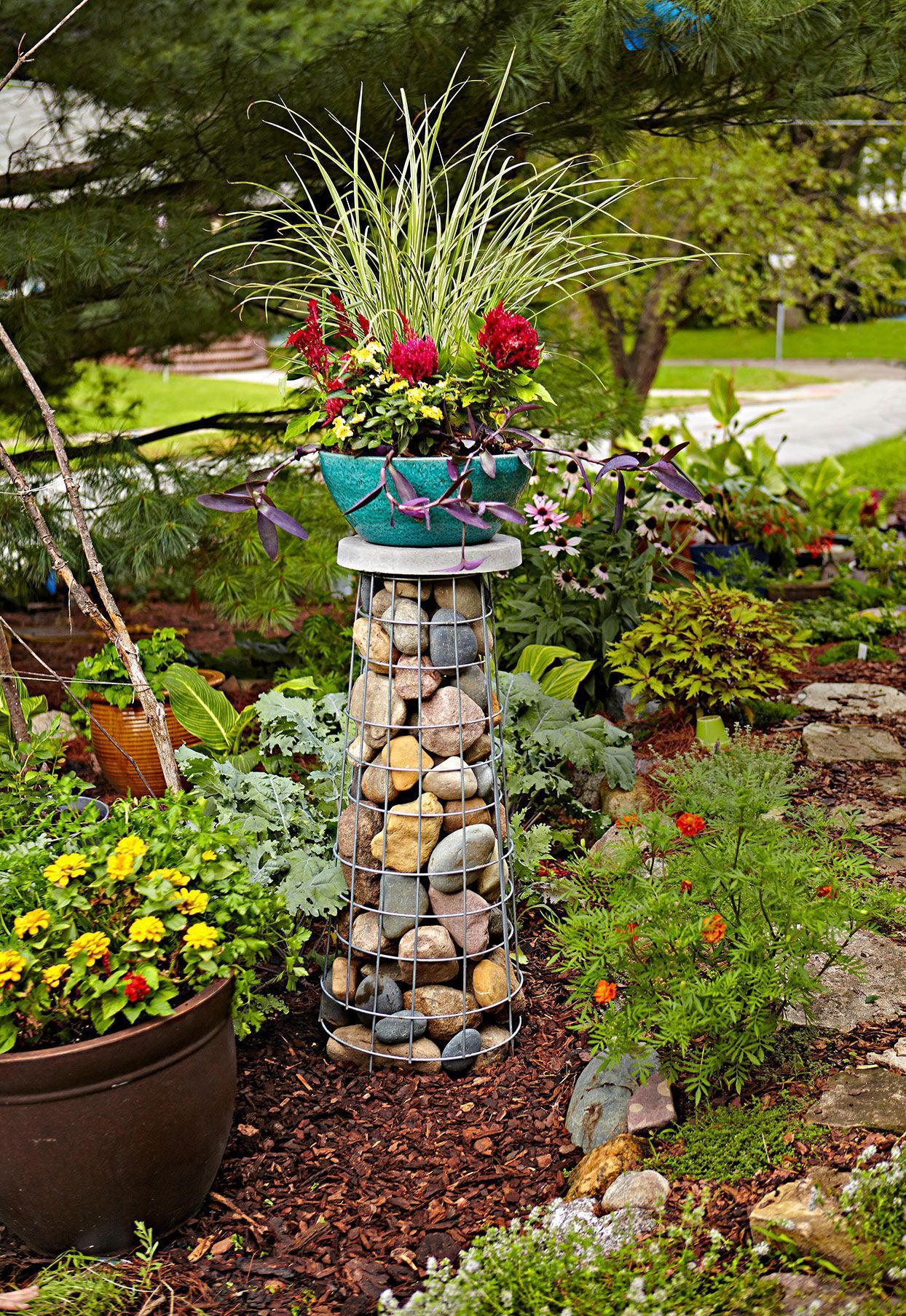 How To Build A Gabion Plant Stand That Will Add A Statement Vertical Accent  To Your Garden | Garden Plant Stand, Garden Art, Container Gardening Intended For Stone Plant Stands (View 4 of 15)