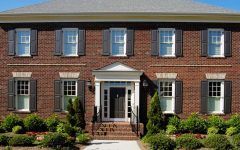 Colonial Brick House Exterior With Black Shutters