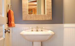 Cottage Powder Room With White Wainscoting and Storage Baskets