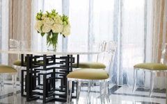 Graphic Wrought Iron Dining Table With Lucite Chairs