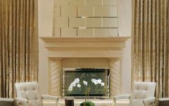 Living Room With Dramatic Fireplace Features Pieces of Beveled Mirror