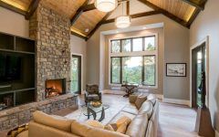 Neutral Rustic Living Room With Wood Ceiling and Stone Fireplace