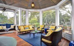 Screened in Porch With Yellow and Blue Upholstered Furniture