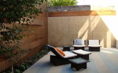 White Cushioning and Textured Retaining Walls Asian Patio Design