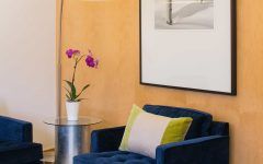 Blue Velvet Armchair and Soft Sheepskin Rug for Modern Sitting Room