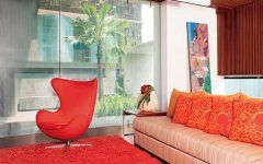 Cozy Living Room with Orange Sofa and Carpet
