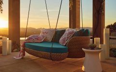 Hanging Daybed With a Mix of Pillows for Outdoor Furniture