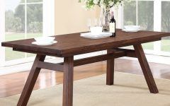 15 Photos Bradly Extendable Solid Wood Dining Tables